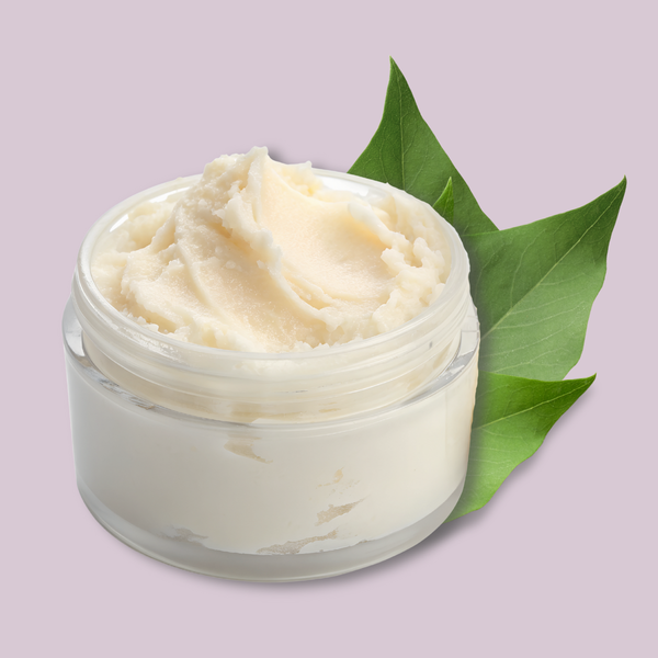 Jar of creamy beef tallow with green leaves on a light purple background