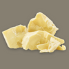 Chunks of cocoa butter on a gray background