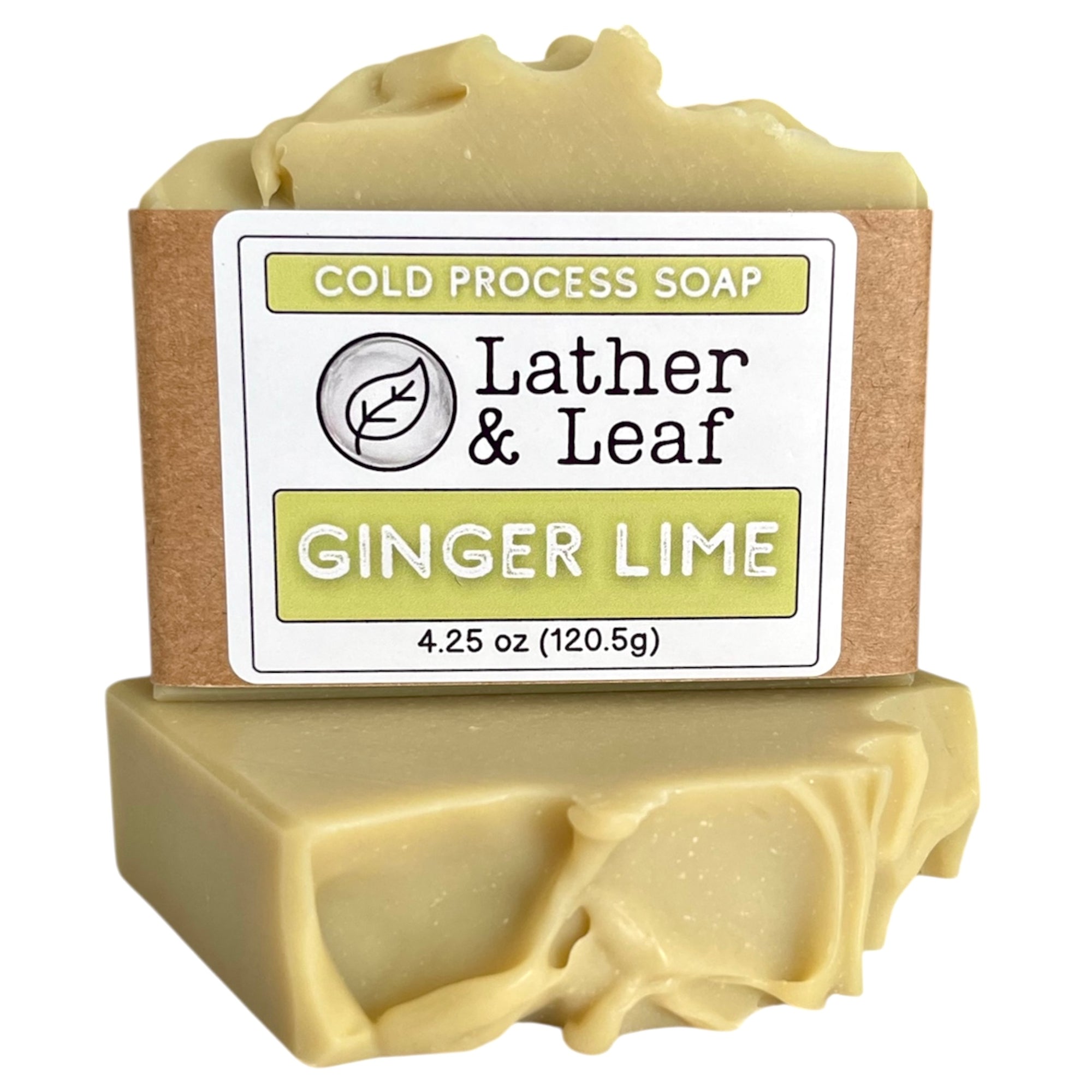 Bar of ginger lime essential oil soap in a box with 'Lather & Leaf' branding and 'Ginger Lime' scent on a white background