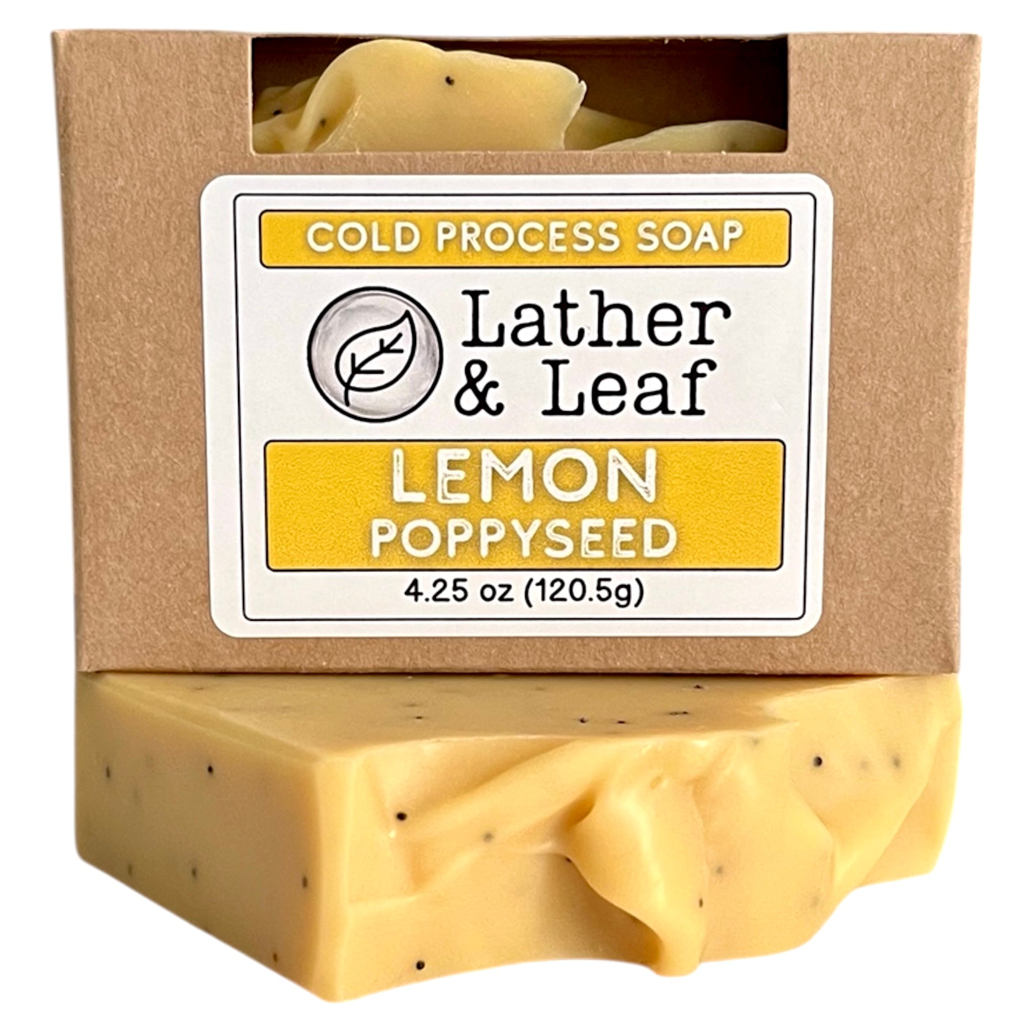 Bar of lemon poppy seed soap in a box with 'Lather & Leaf' packaging on a white background