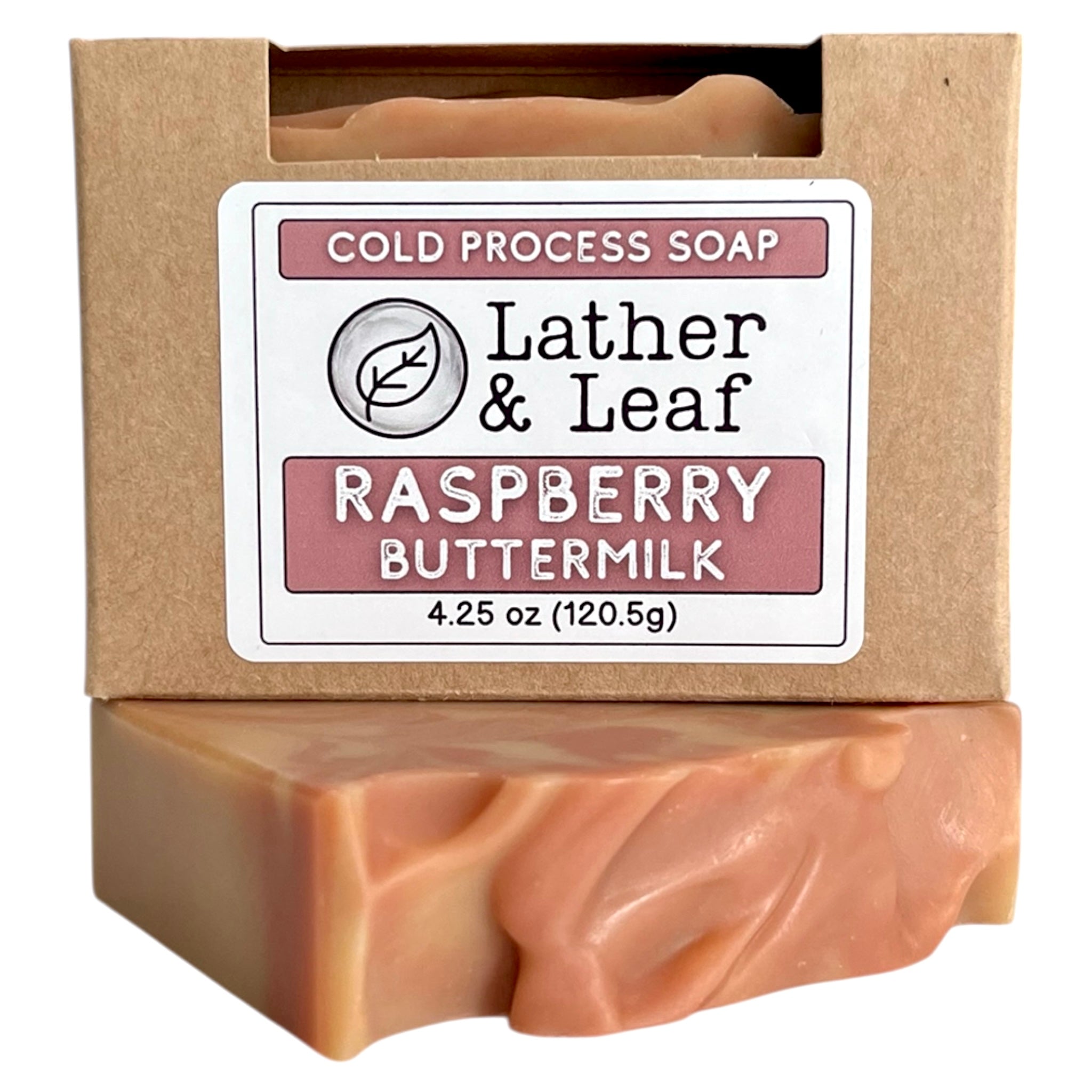 A bar of Raspberry Buttermilk soap in a box with Lather and Leaf label