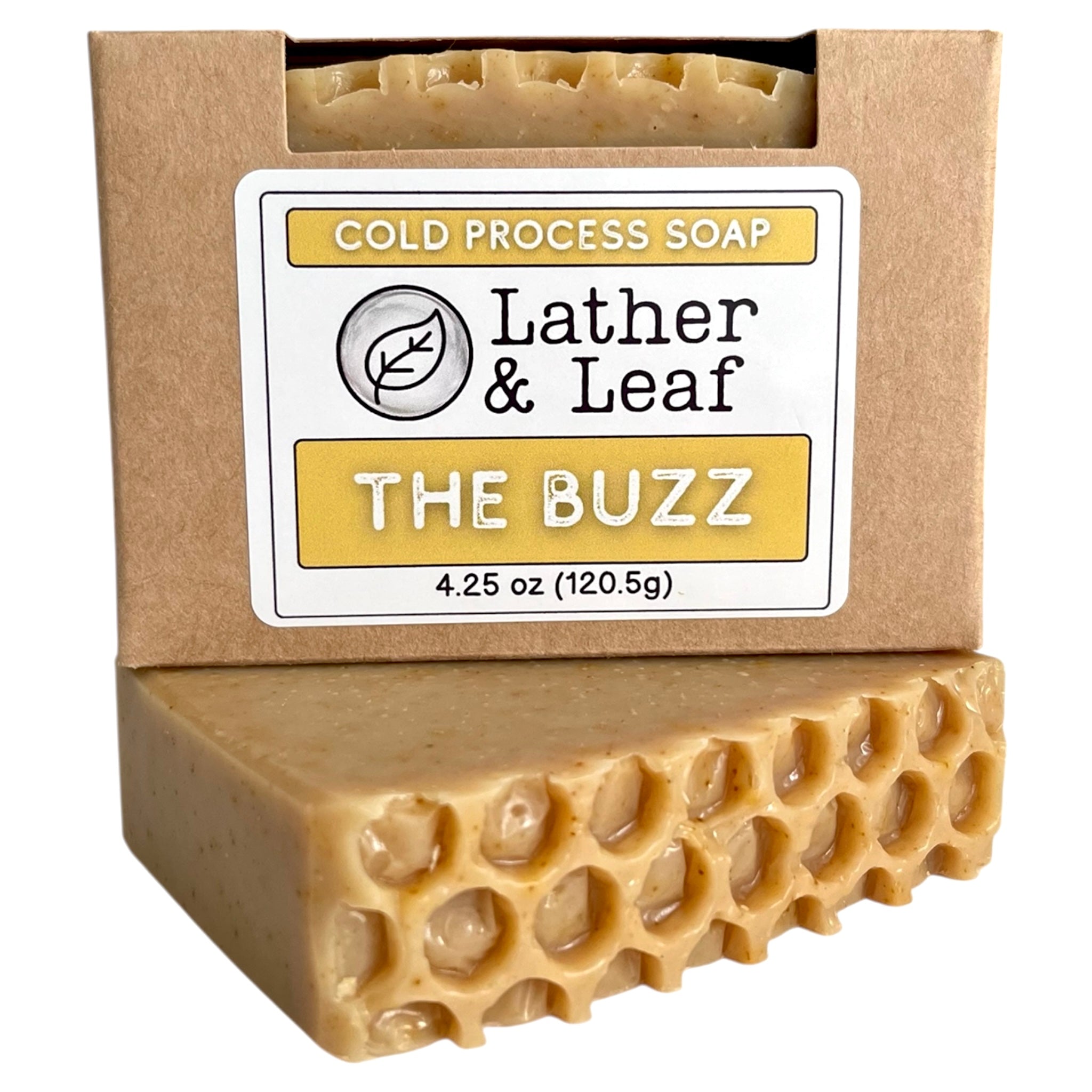 Bar of soap with a honeycomb pattern on a brown cardboard packaging featuring 'Lather & Leaf' branding.